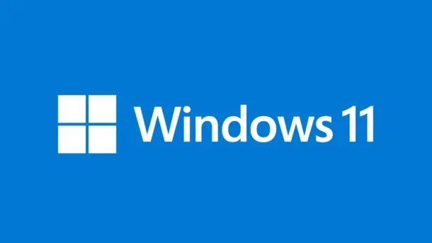 White Windows 11 logo and text on a solid blue background.