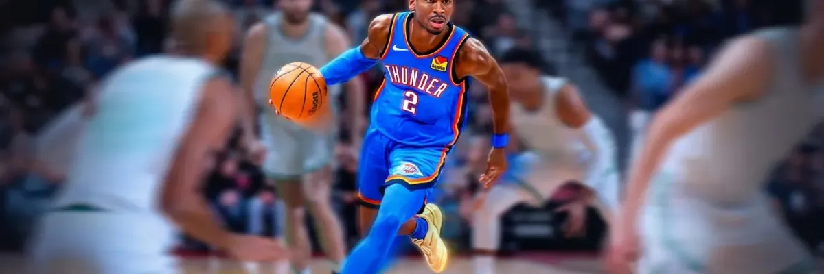 A basketball player in a blue Thunder jersey dribbles the ball during a game, with opponents and a crowd in the background.