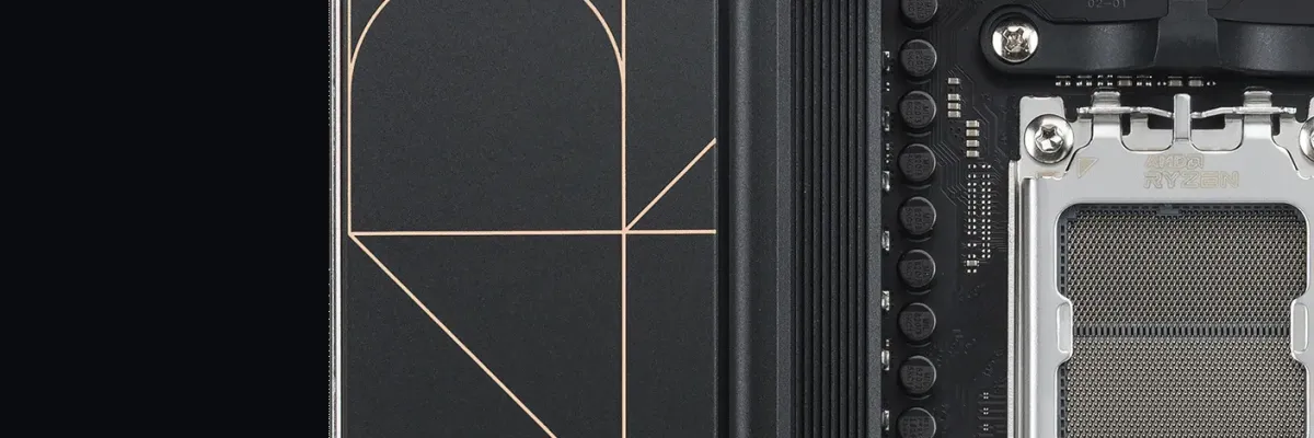 Black ASUS ProArt motherboard with gold accents, CPU socket, RAM slots, and M.2 slots, featuring geometric design elements.