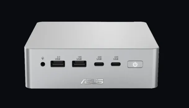 Silver ASUS mini PC front panel with USB ports, power button, and logo on black background.